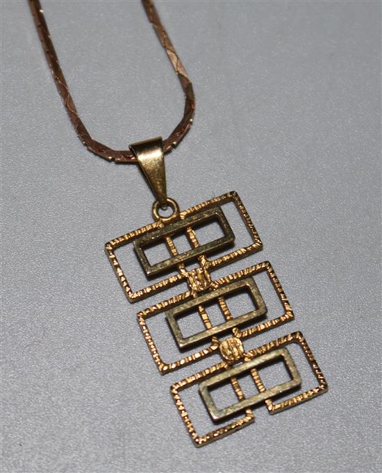 A 9ct gold rectangular openwork pendant, on a 9ct gold chain, pendant 28mm.